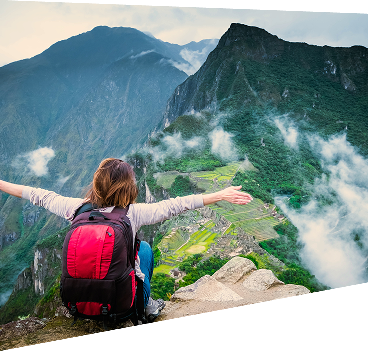 Hiker with backpack overlooking a mountain valley