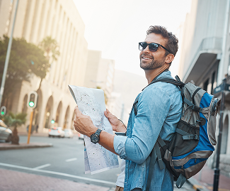 Traveler reading a map in the city