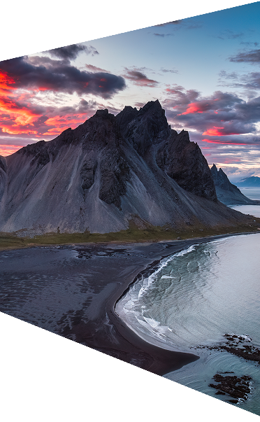Dramatic mountain peak by the ocean at sunset
