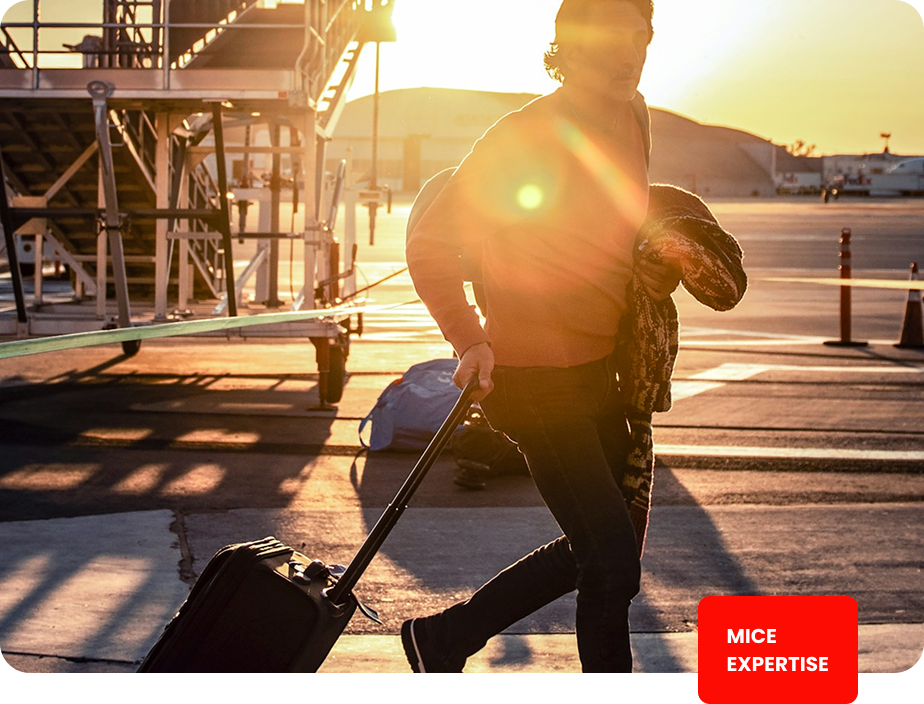 Business traveller with luggage at an airport